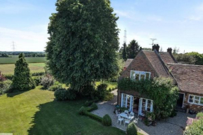 Old school house surrounded by countryside
